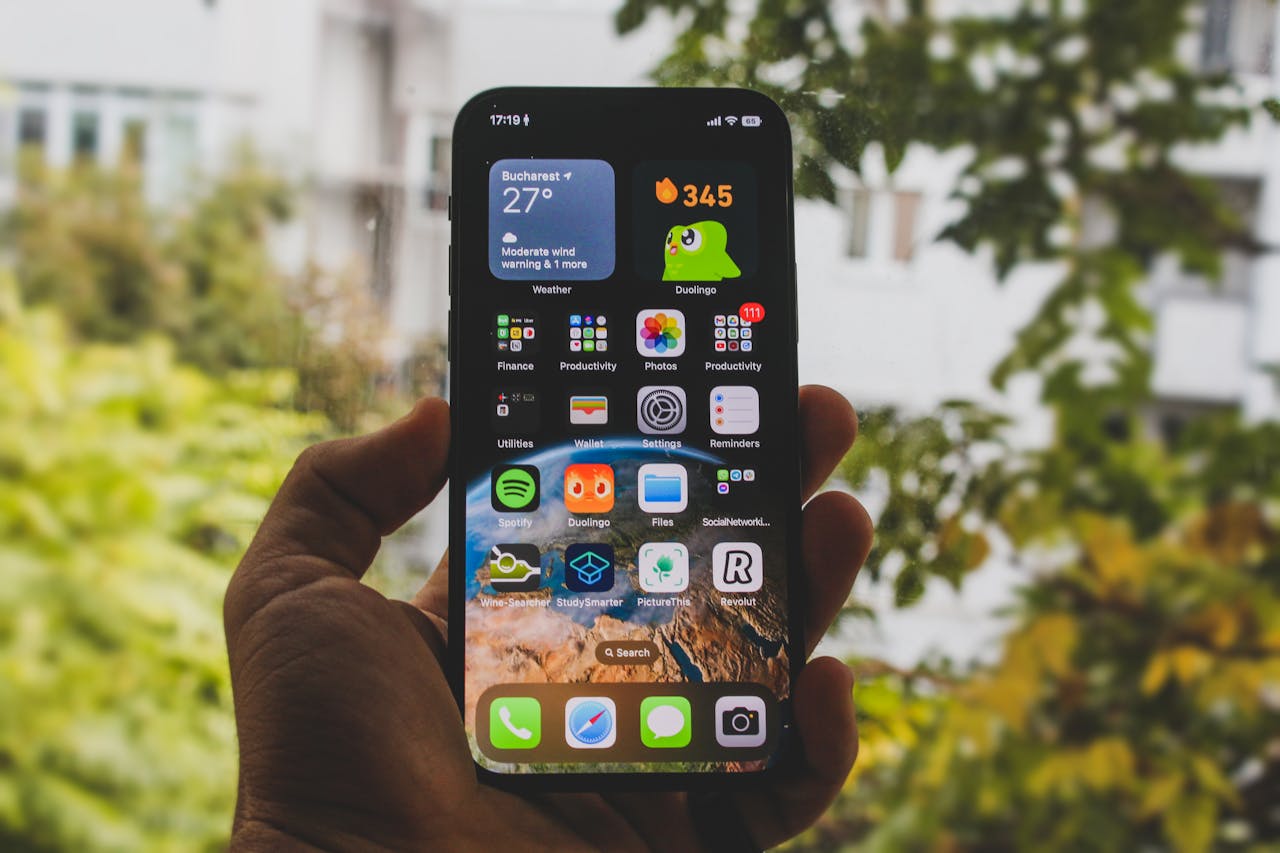A phone with duolingo icons on it on its home screen